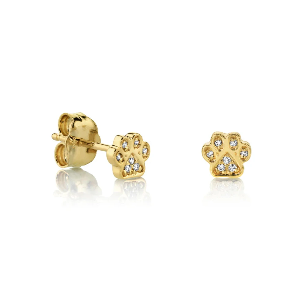 Gold paw print earrings on a white background